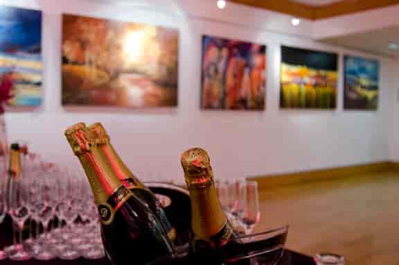 Elegant Knapp Gallery event space with champagne display, perfect for networking receptions.
