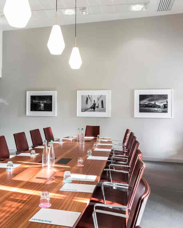 Modern Frobisher Boardroom with sleek table, ideal for professional meetings and conferences.