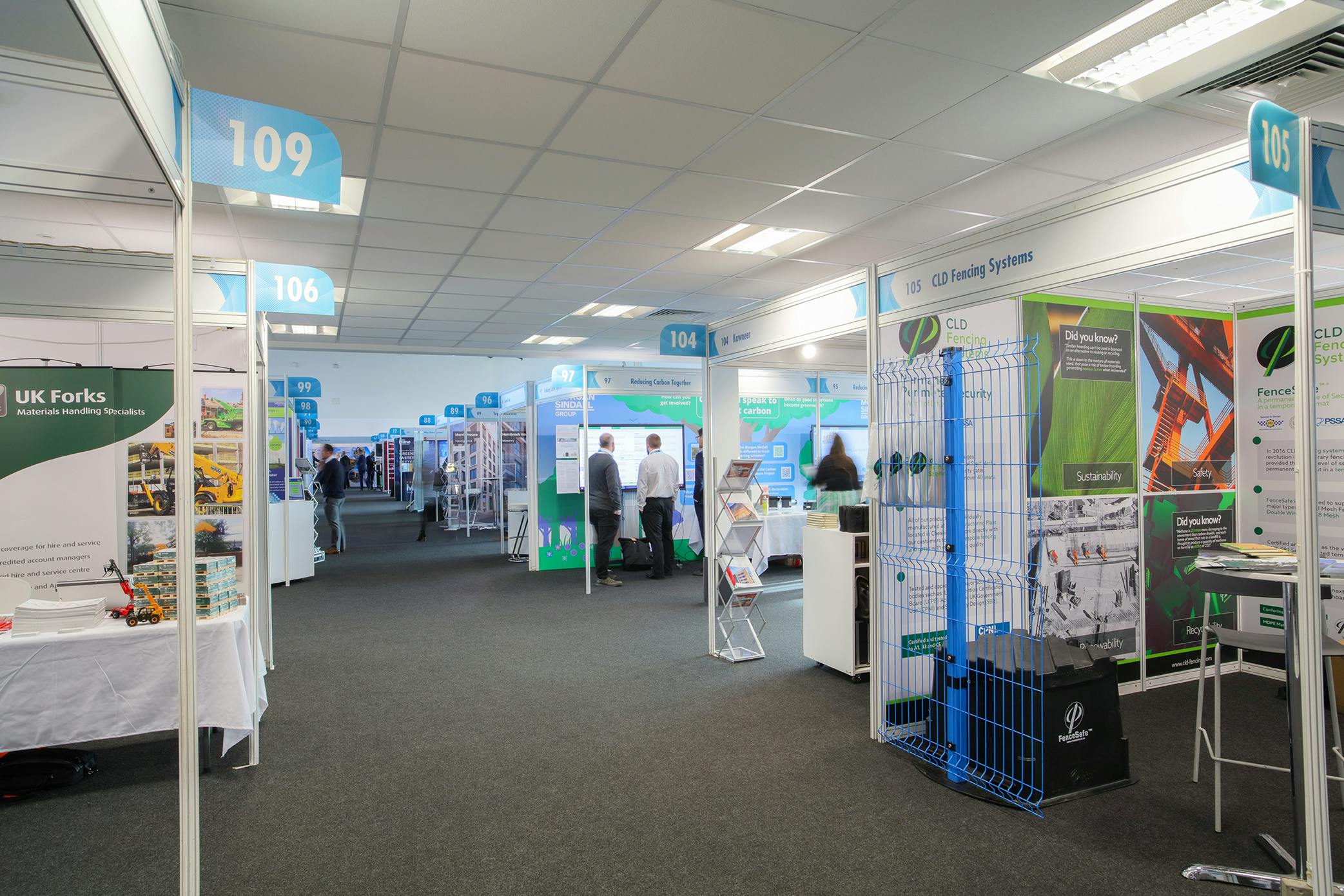 Silverstone exhibition hall with organized booths for networking and events.