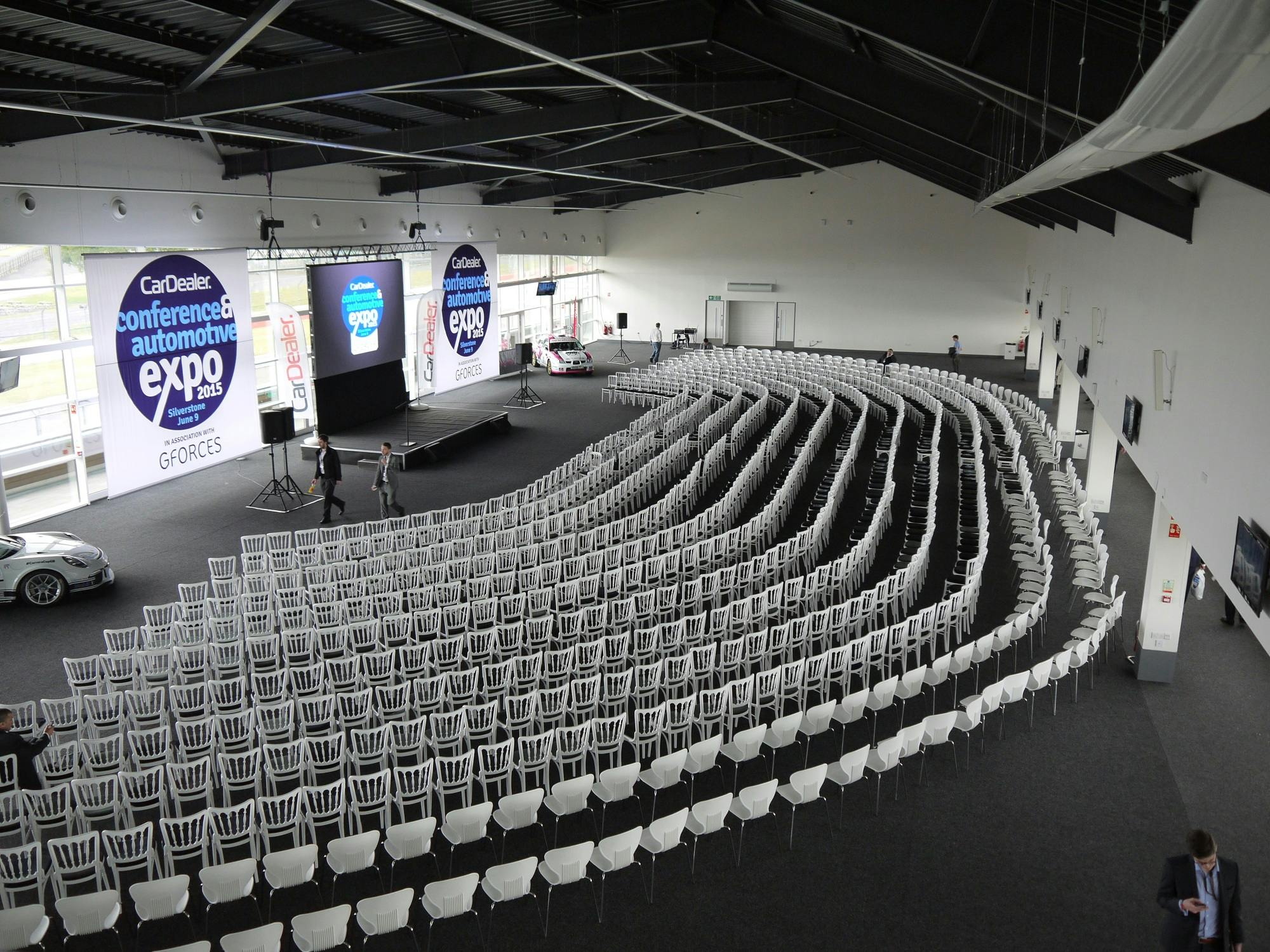 Hall 3 at Silverstone: spacious conference setup with white chairs for engaging presentations.