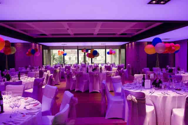 Elegant event space at Barbican Centre with festive balloons for galas and celebrations.