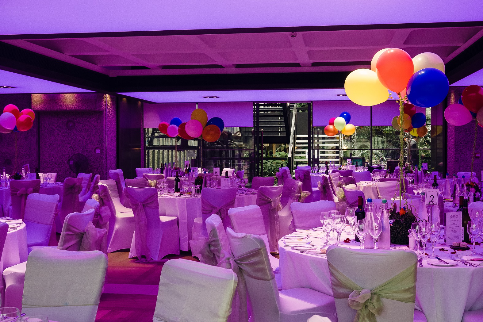 Barbican Garden Room event setup, purple lights, elegant banquet. - Banner