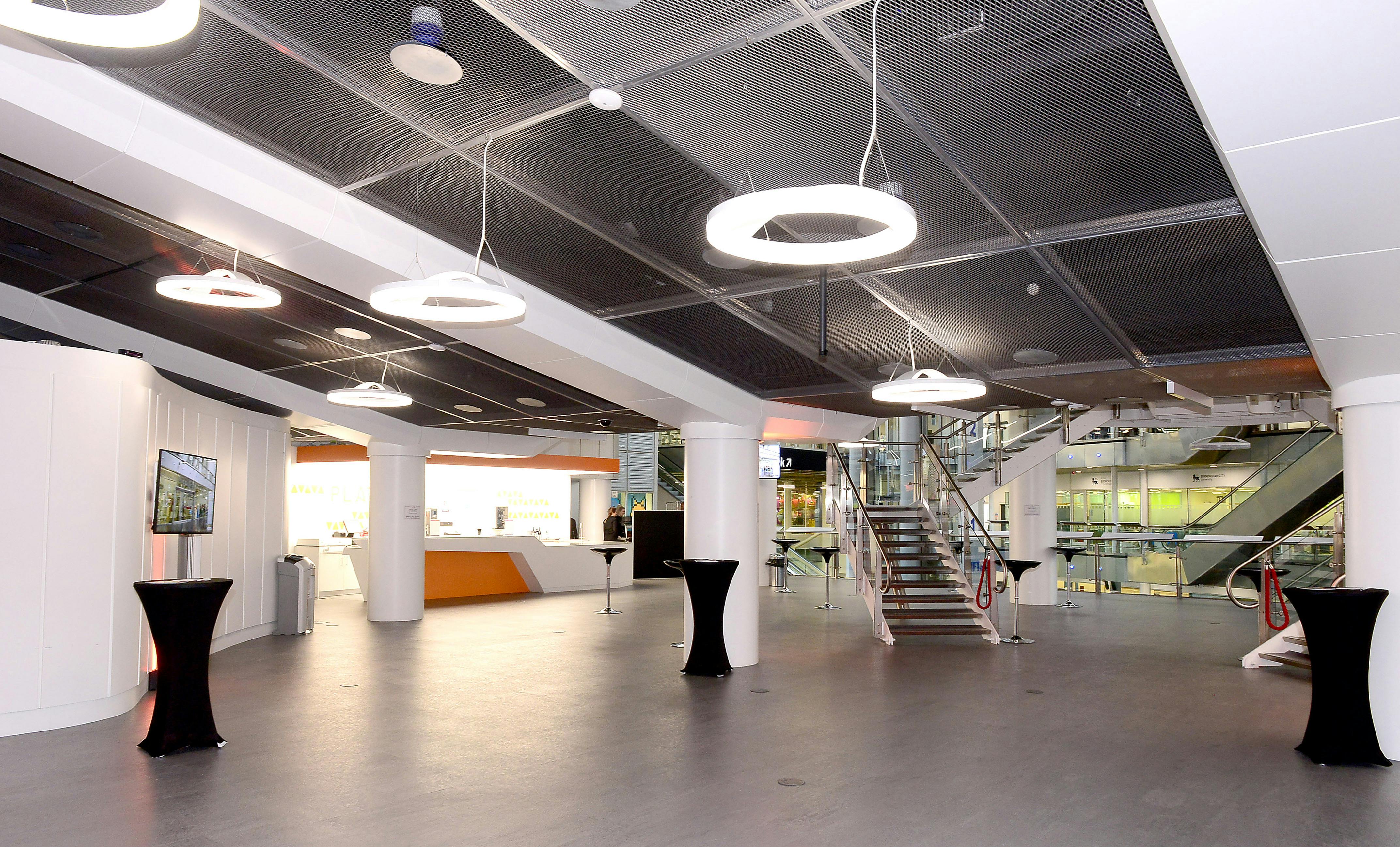 Modern event space at Millennium Point with high ceilings, ideal for receptions and networking.