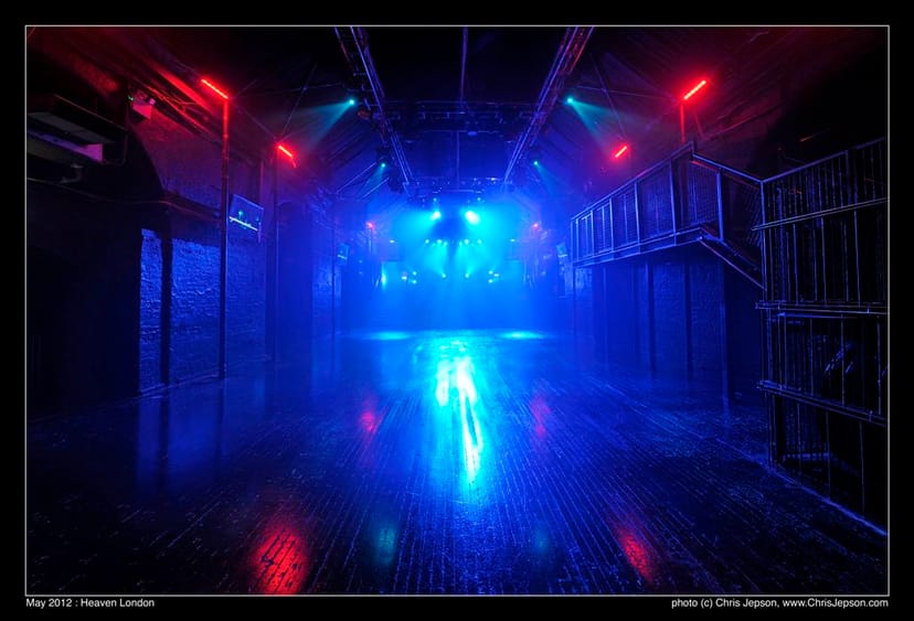 Versatile event space with dramatic lighting, perfect for corporate events and parties.