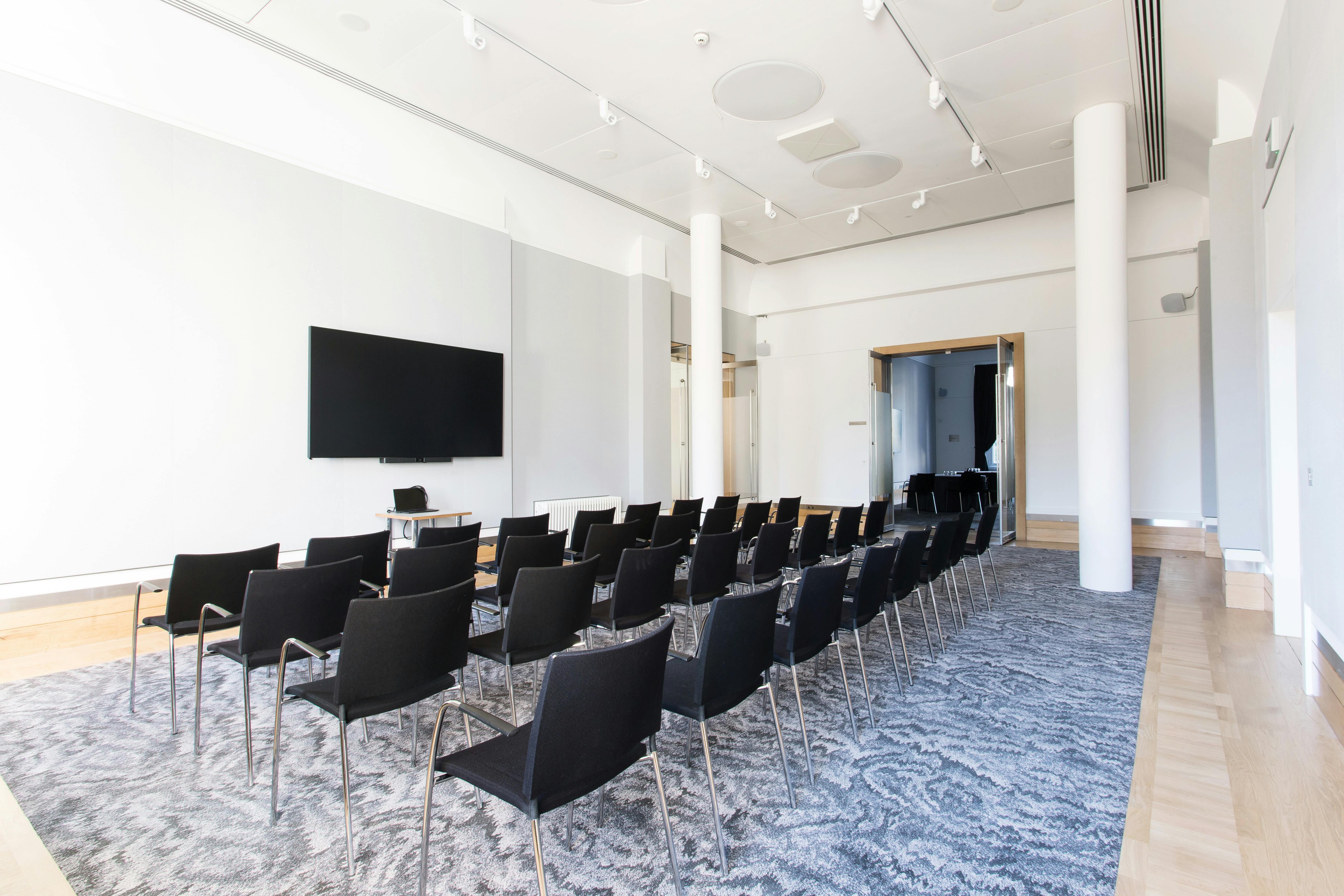 David Sainsbury in modern meeting space, ideal for corporate events and workshops.