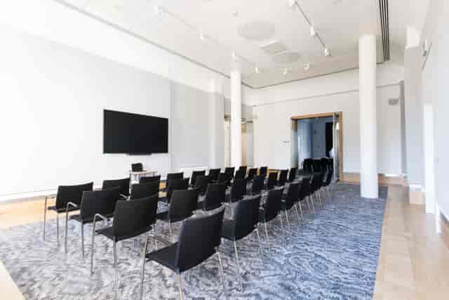 David Sainsbury in modern meeting space, ideal for corporate events and workshops.