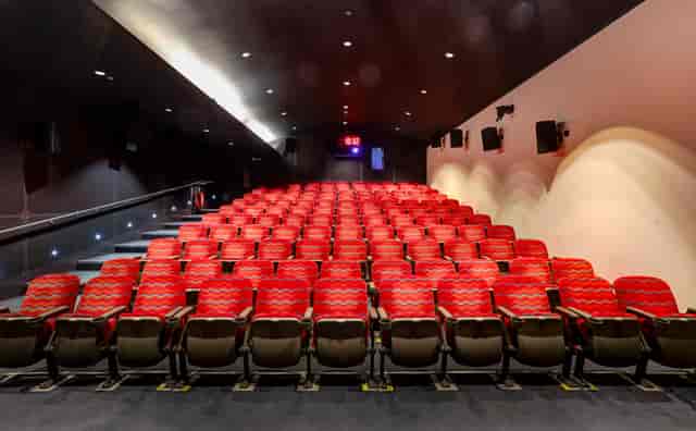 Cubic Theatre in London Transport Museum with red seating for corporate events and film screenings.