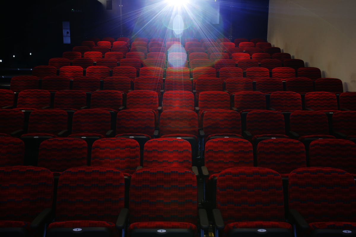 Cubic Theatre at London Transport Museum with vibrant red seating for events and presentations.