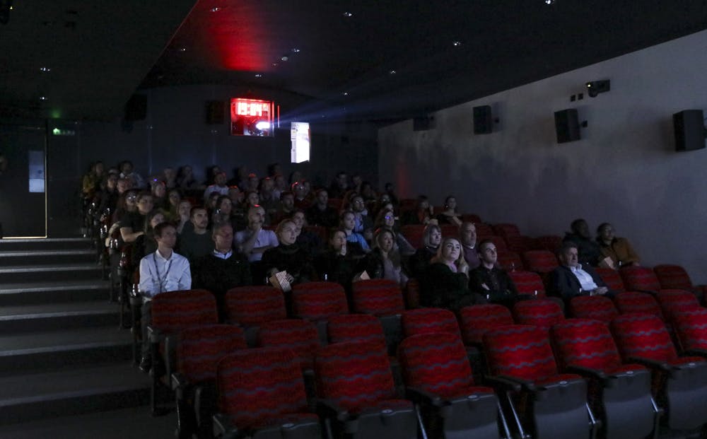 Cubic Theatre auditorium with tiered seating, ideal for presentations and screenings.