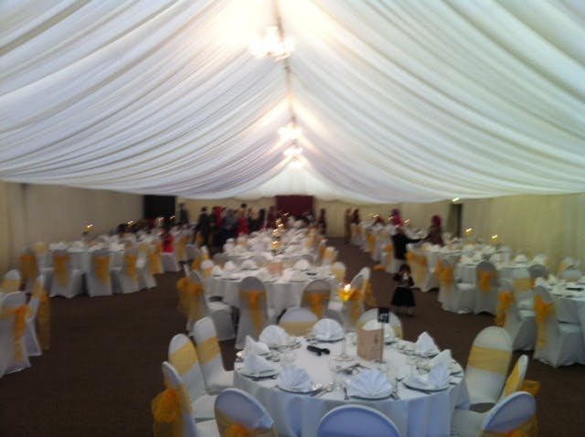 Elegant Dray Marquee event space with draped ceilings, perfect for weddings and corporate events.