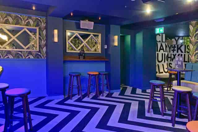 Vibrant Studio 61 event space with bold decor, perfect for networking and gatherings.