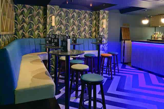 Stylish event space in Sway with vibrant decor, perfect for networking and gatherings.