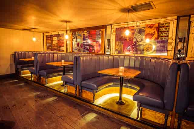 Stylish Cocktail Lounge seating with plush booths for networking events and gatherings.