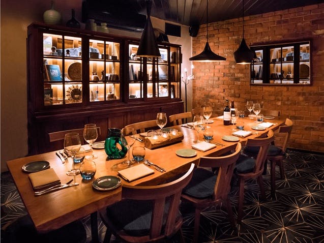 Intimate private dining room with elegant decor for corporate dinners and networking events.