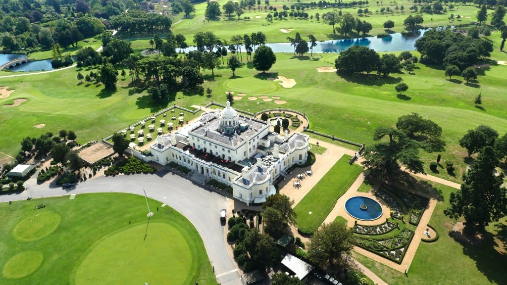 Elegant function room at Stoke Park for weddings and corporate events, surrounded by greenery.