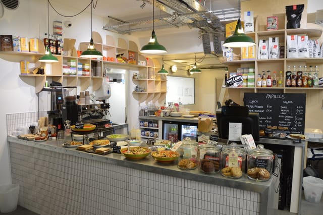 Modern café venue with inviting counter, ideal for networking and informal meetings.