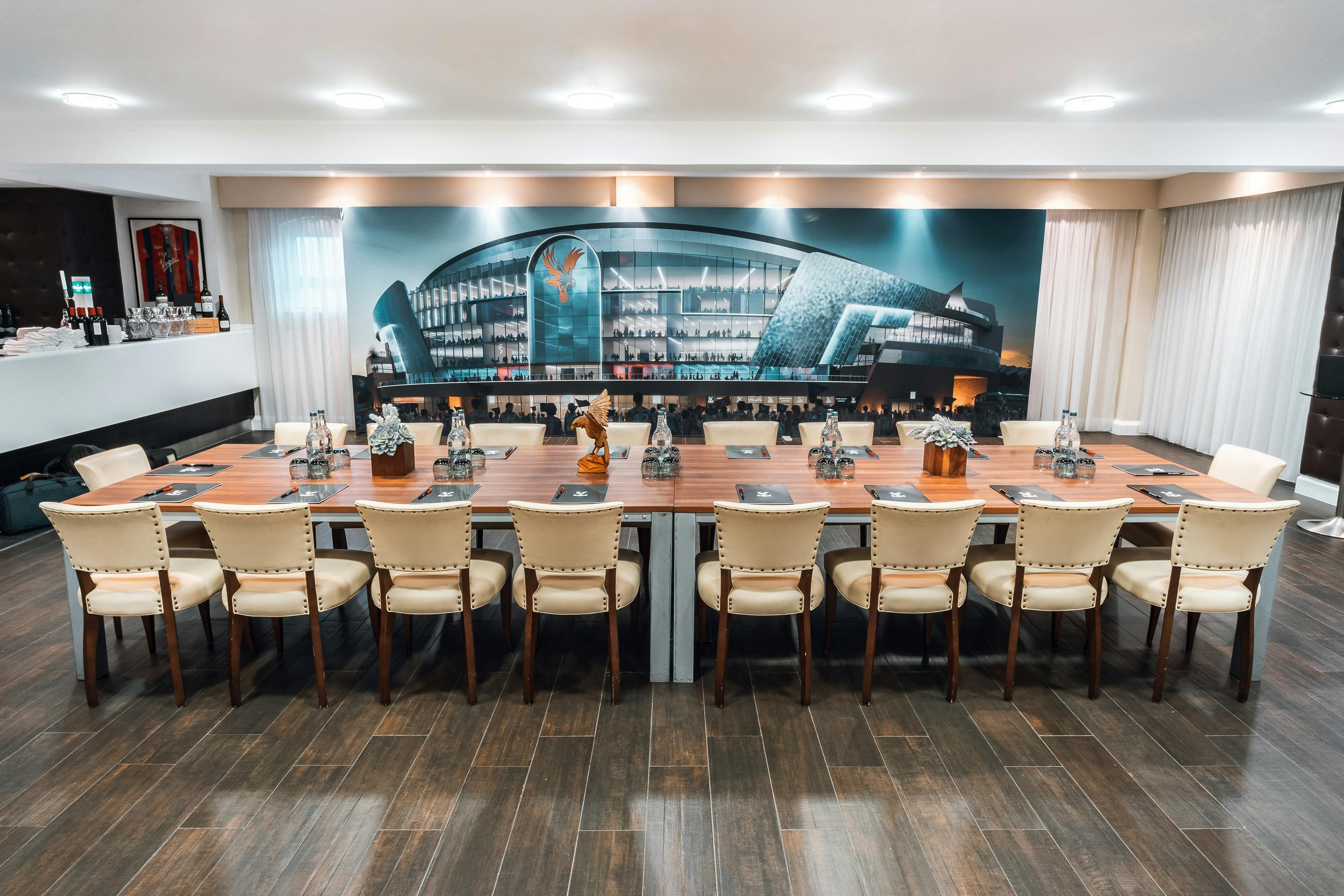 Boardroom at Selhurst Park Stadium with elegant table, ideal for meetings and events.