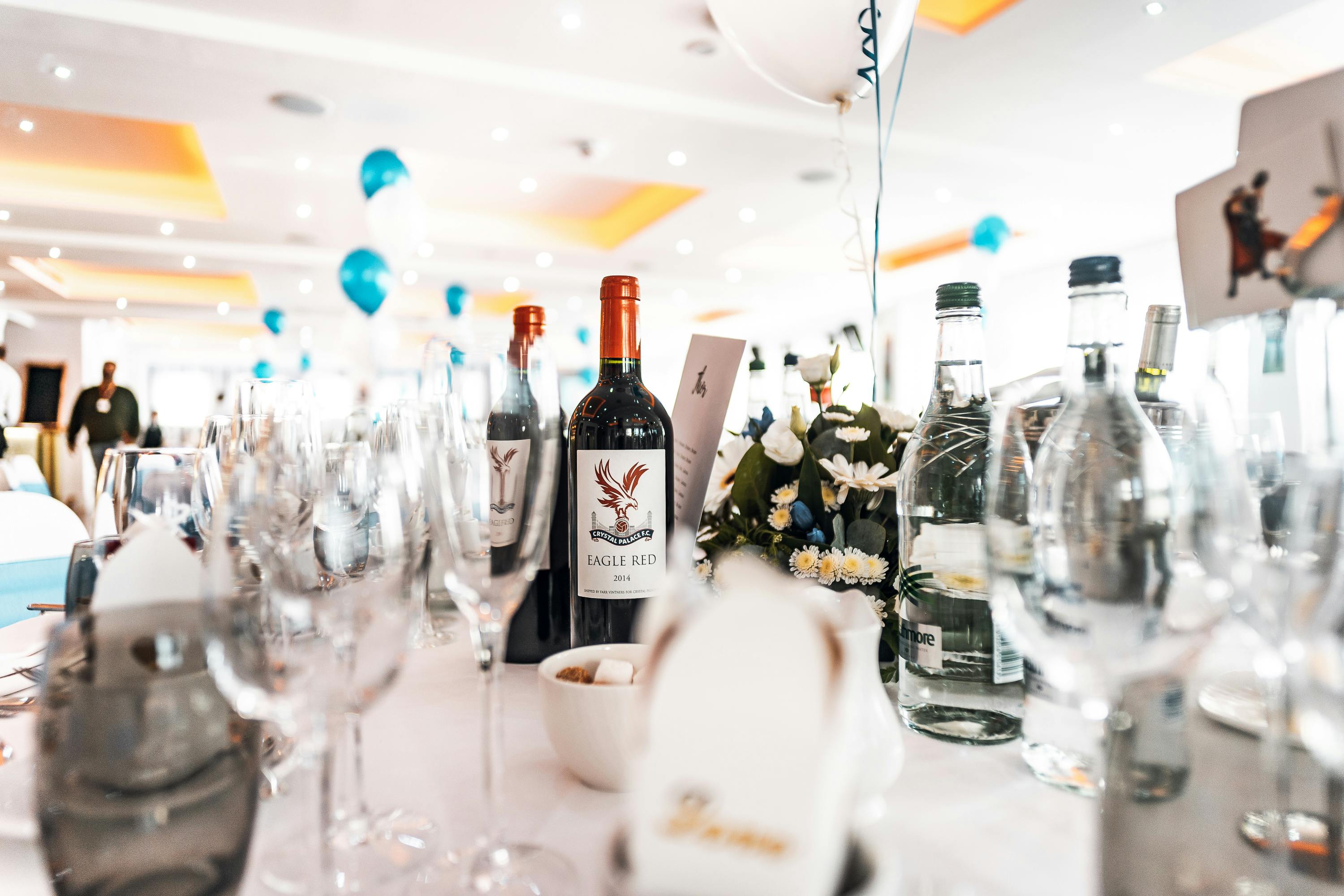 Stanley Stephenson Lounge event table with wine, glassware, and festive decor at Selhurst Park.