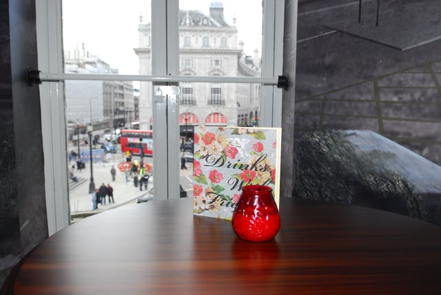 Elegant table setup with red vase at Fruitbox, Piccadilly Institute for events.