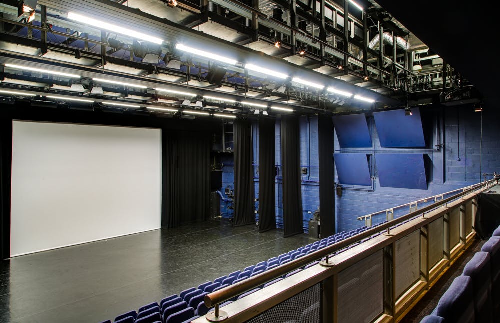 Lilian Baylis Studio stage with seating, ideal for conferences and performances.