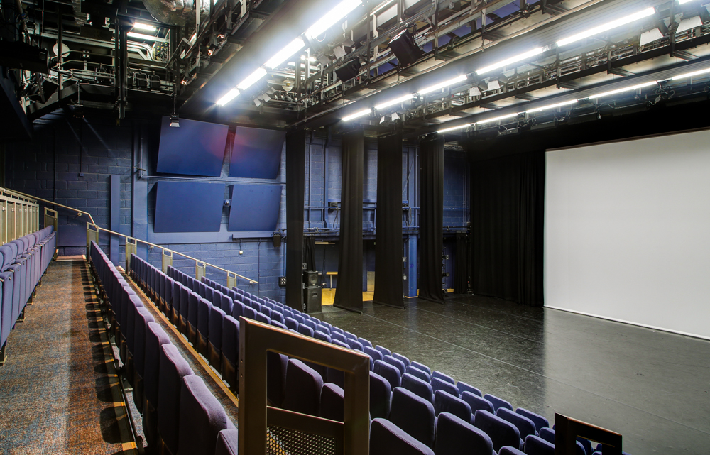 Lilian Baylis Studio event space with tiered seating for conferences and performances. - Banner