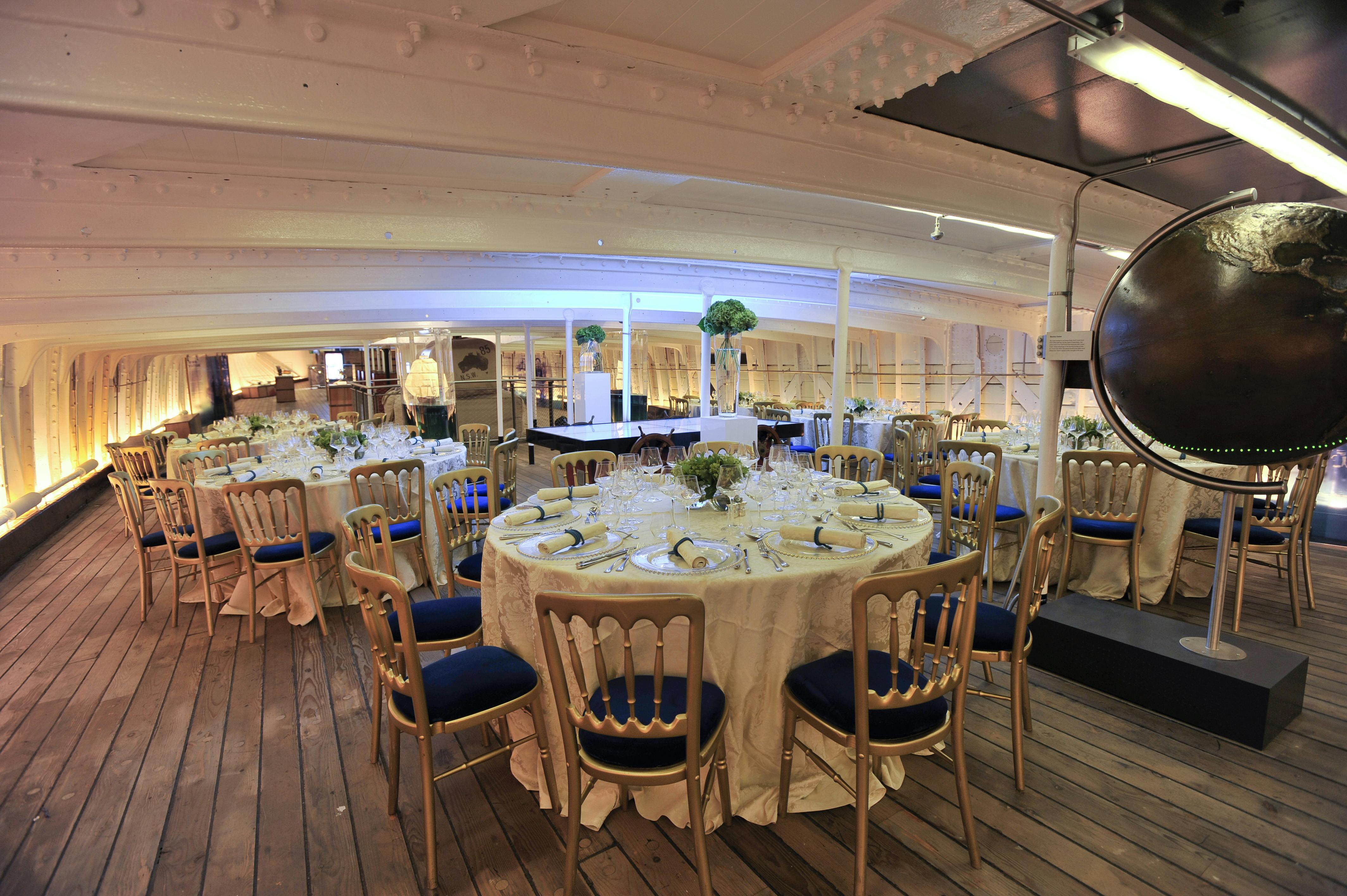 Elegant dining area on Tween Deck, Cutty Sark, perfect for upscale events and gatherings.