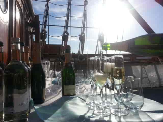 Elegant table setting with drinks on Masters Saloon, Cutty Sark for events and celebrations.