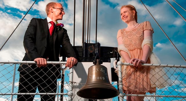Couple celebrating wedding on The Weather Deck, Cutty Sark, unique nautical venue.