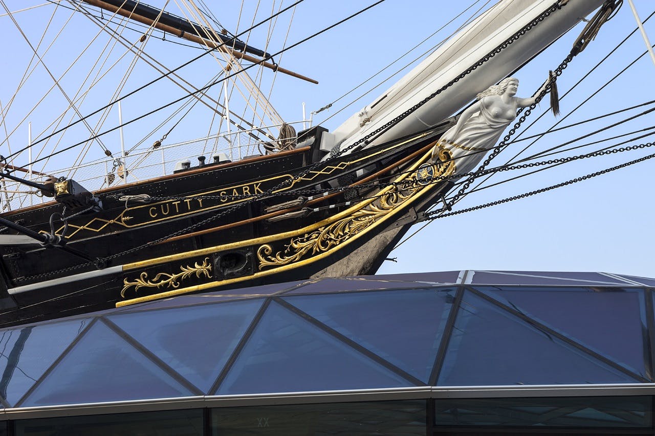 Cutty Sark bow with modern glass structure, perfect for unique corporate events.