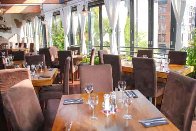 On Bar venue with floor-to-ceiling windows, ideal for corporate luncheons and networking events.