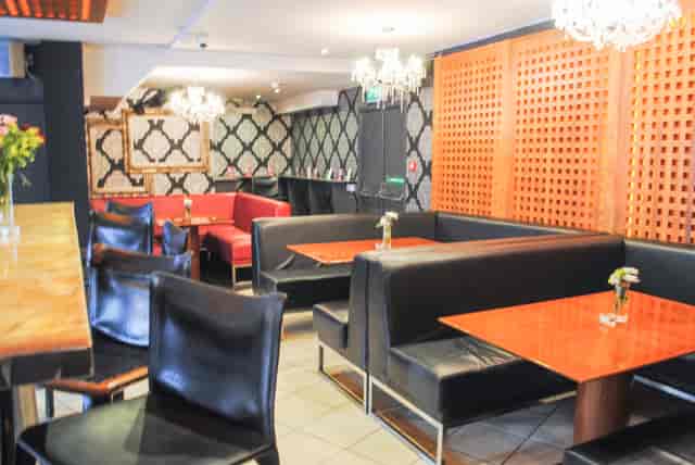 On Bar venue with booth seating for casual networking and corporate breakout events.