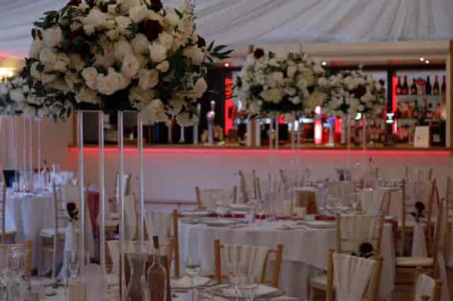 Elegant event space with floral arrangements for weddings and formal gatherings.