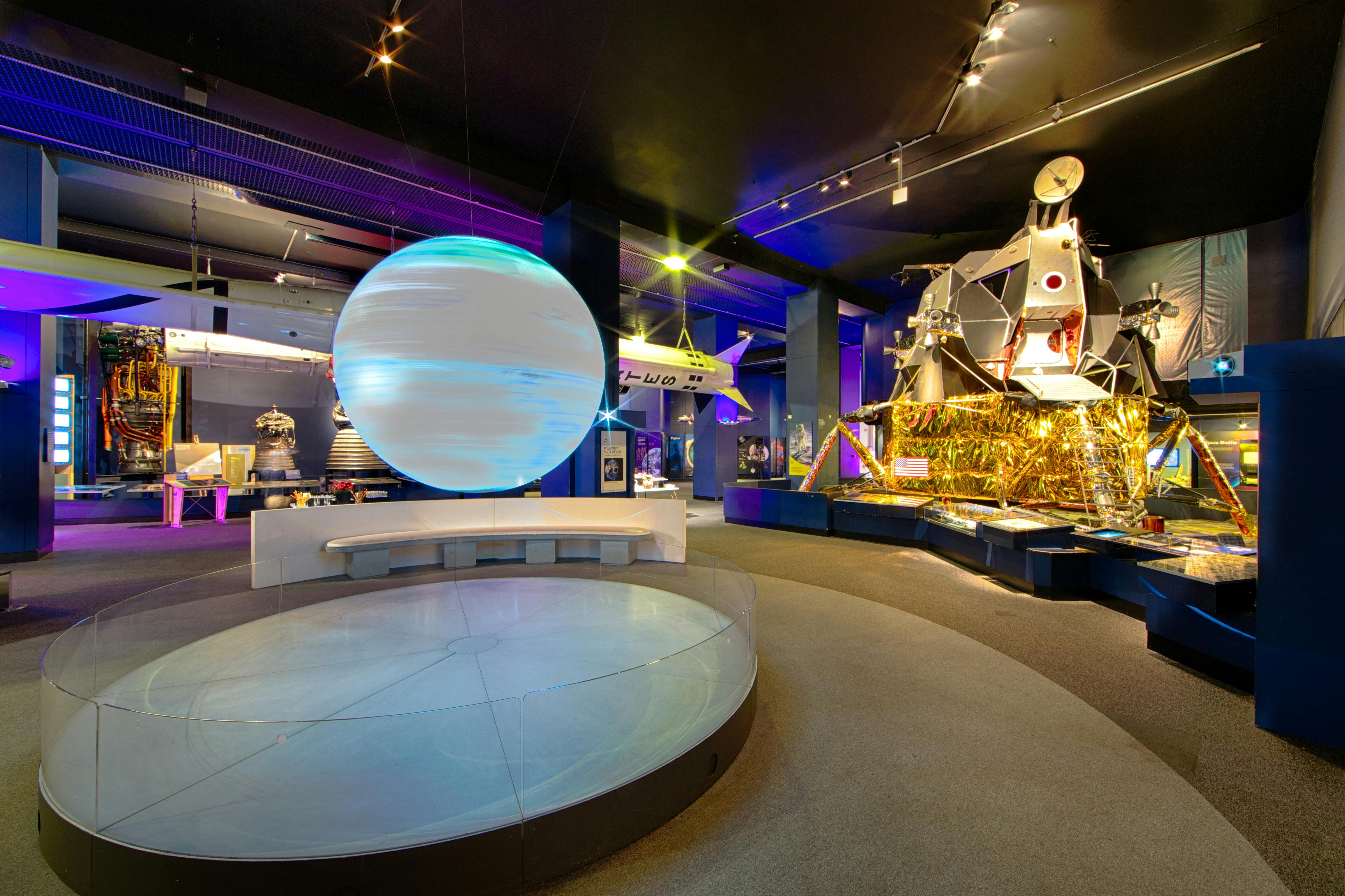 Exploring Space exhibit at The Science Museum with a central spherical display for events.