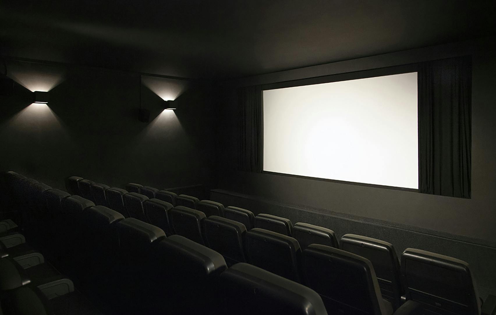 Sleek screening room at Close-Up Film Centre for private events and film viewings.