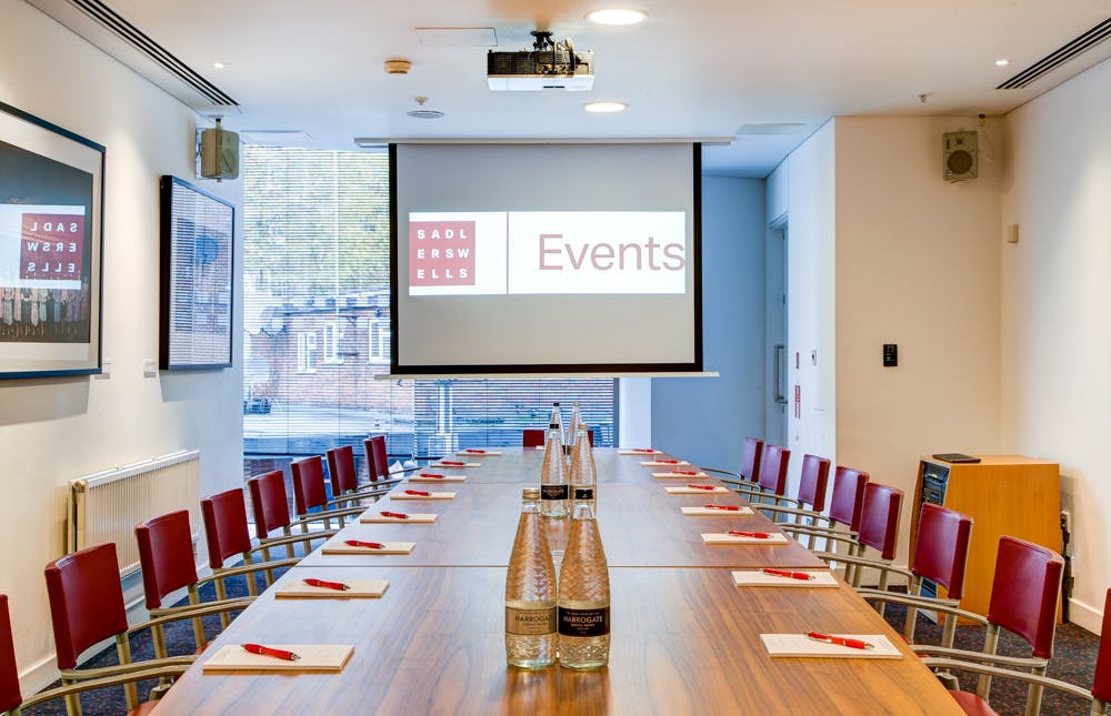 Pina Bausch Room at Sadler's Wells, featuring a long table for corporate events.