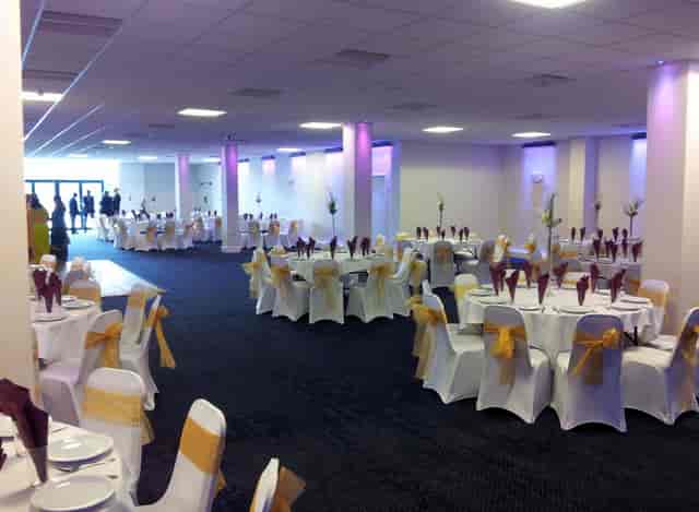 Elegant event space with round tables, perfect for weddings and corporate events.