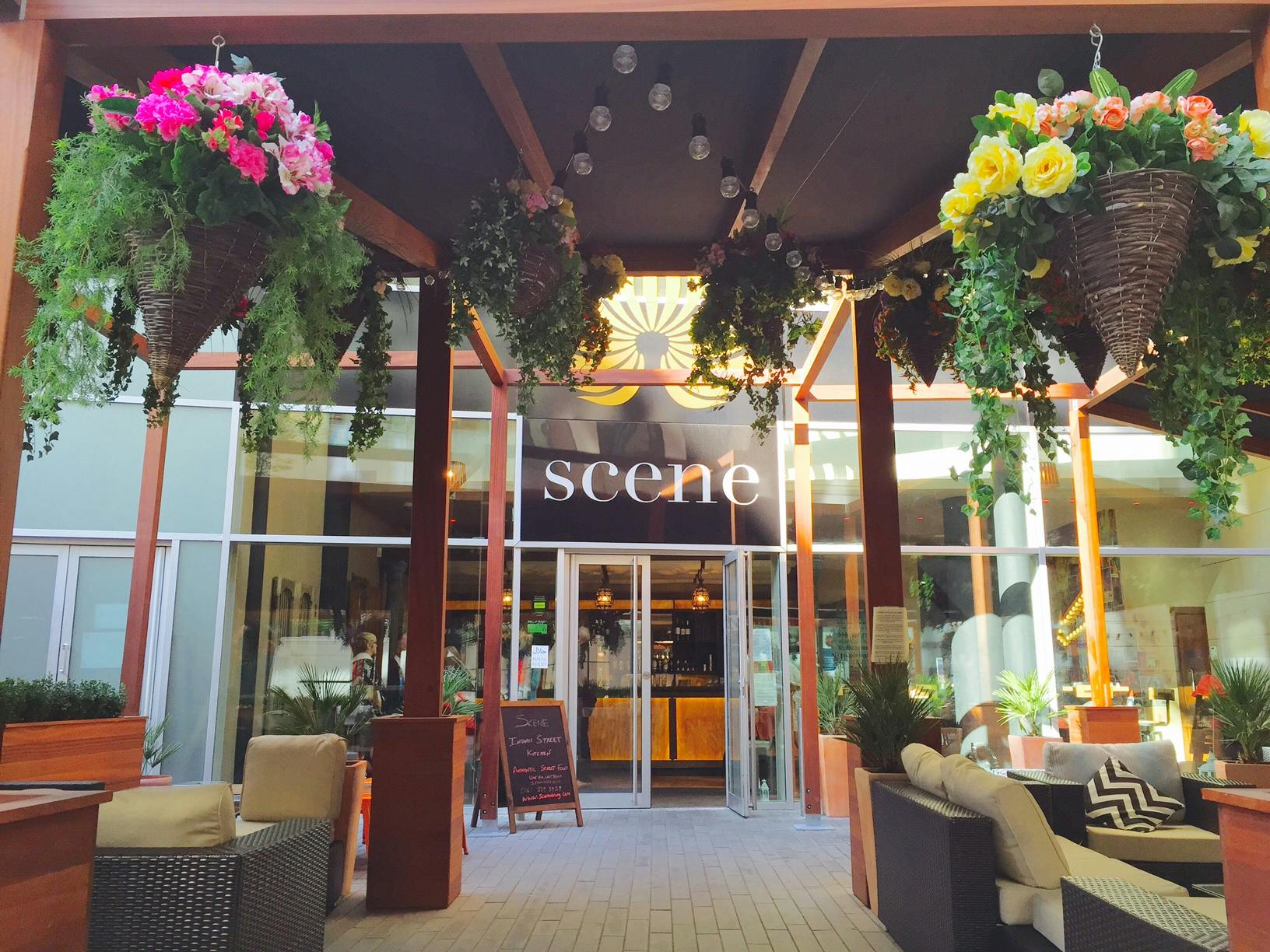Garden Veranda entrance with vibrant flowers, perfect for social gatherings and events.