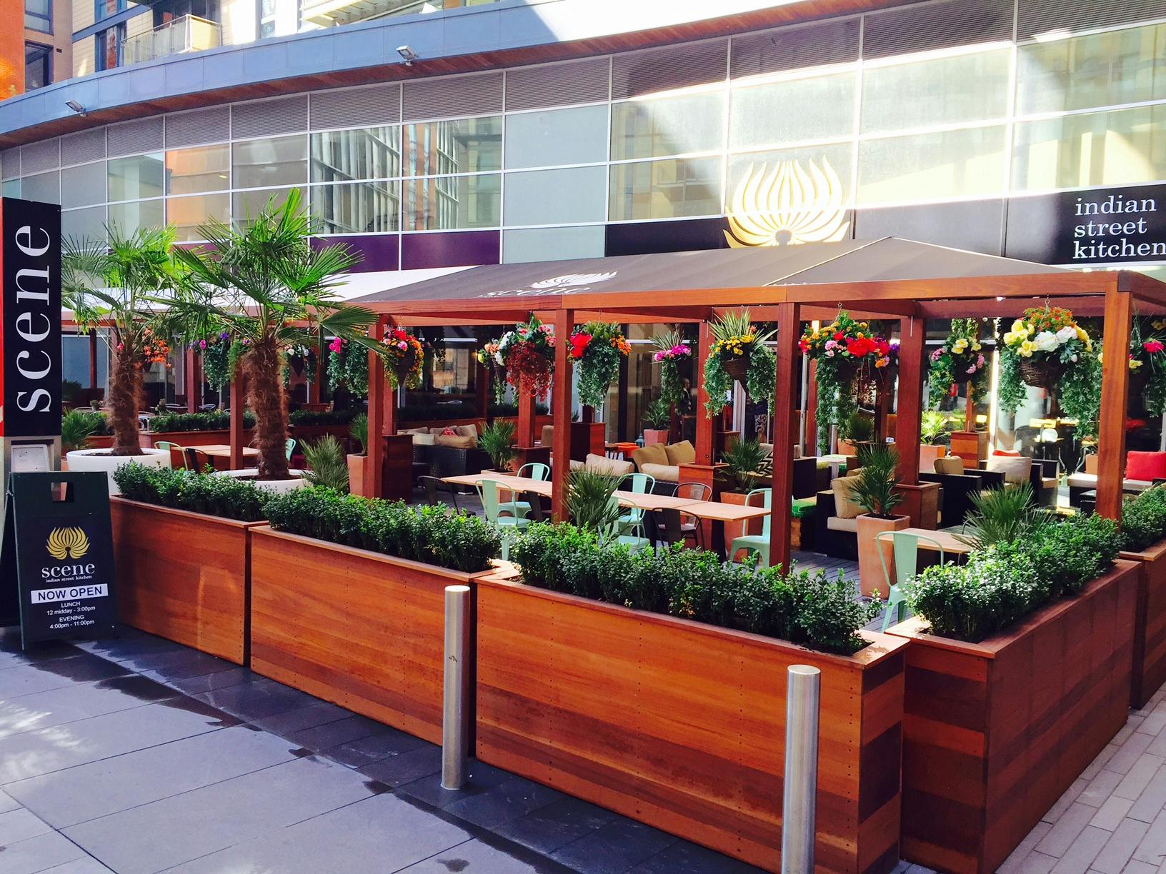 Vibrant outdoor dining space at Garden Veranda, ideal for casual meetings and events.