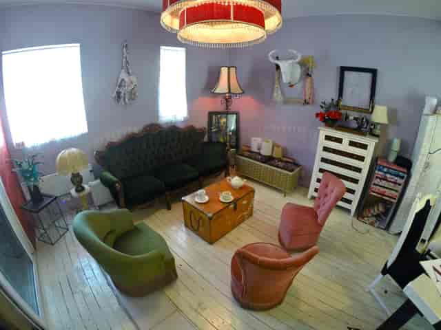 Cozy meeting space in Dalston Popup Loft with vintage furniture for intimate gatherings.
