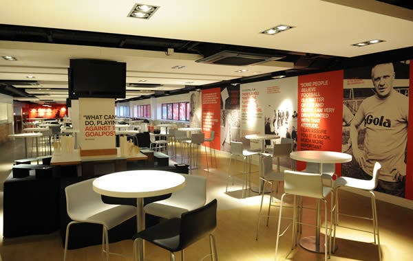 Modern Shanks Lounge at Liverpool FC, ideal for meetings and workshops with vibrant decor.