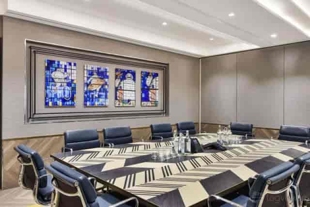 Executive boardroom with leather seating for high-stakes business meetings and corporate events.