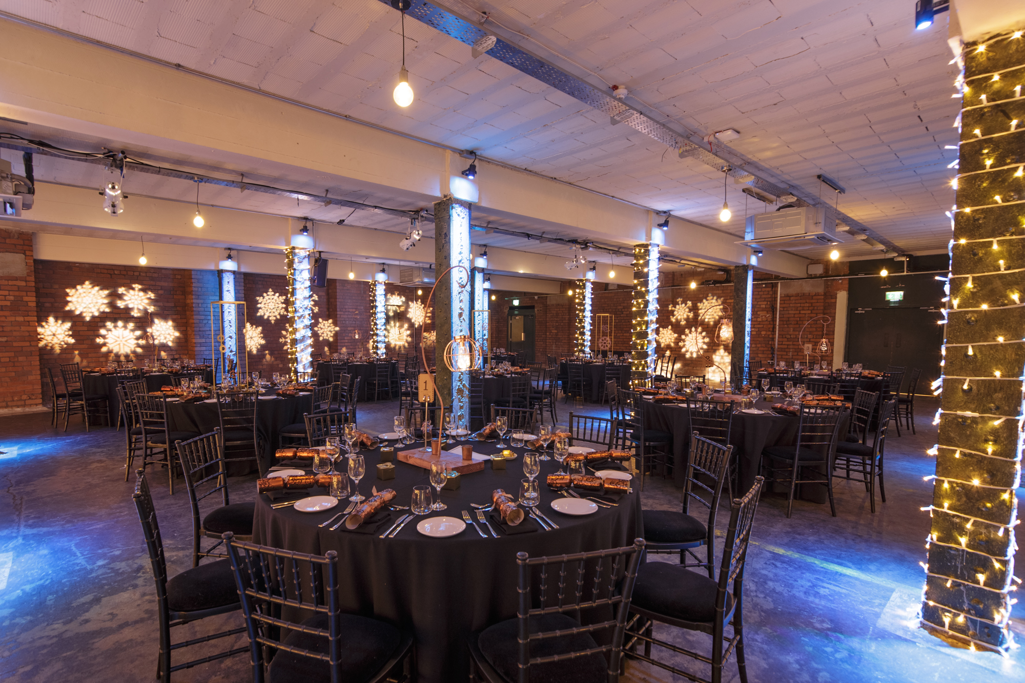 Elegant event space at The Bays, Victoria Warehouse with festive decor for corporate gatherings. - Banner
