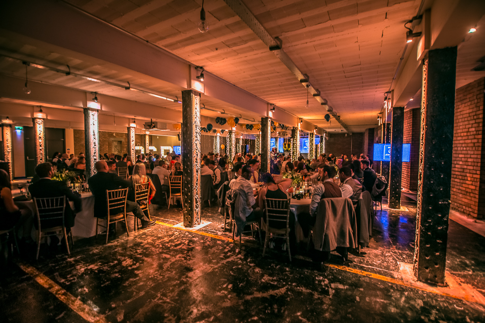 Elegant event at The Bays, Victoria Warehouse with stylish tables and ambient lighting. - Banner