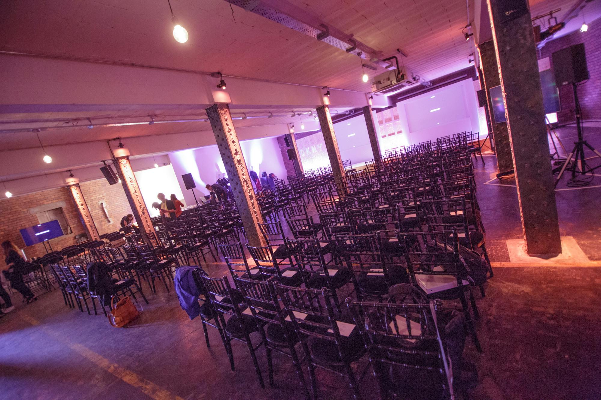 Spacious Victoria Warehouse event venue with chairs for presentations and conferences.