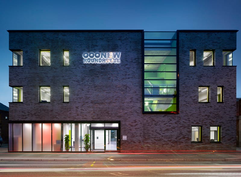 Modern training room with large windows, perfect for corporate meetings and events.