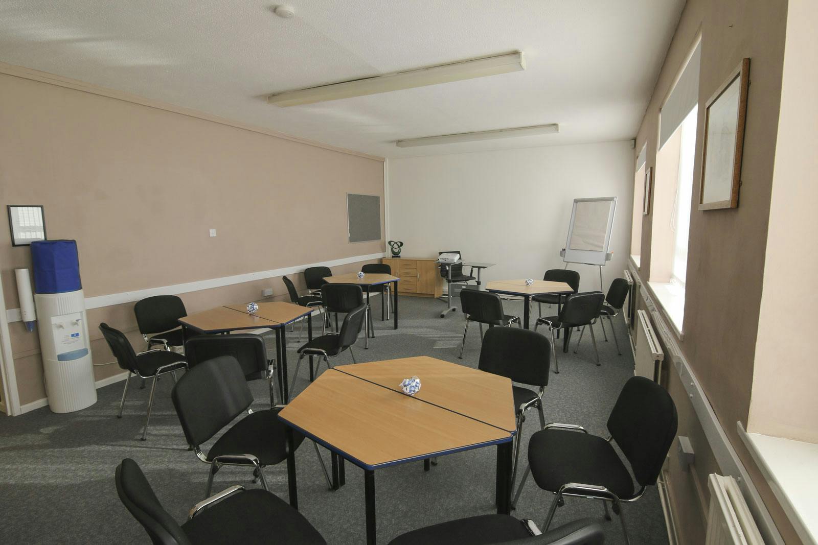 Ayton Room in Ayton House, versatile meeting space with hexagonal tables for workshops.