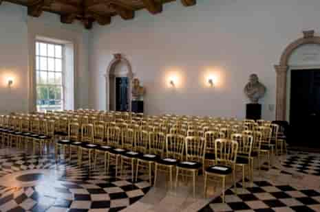 Elegant gold chairs in The Great Hall, perfect for upscale events and conferences.