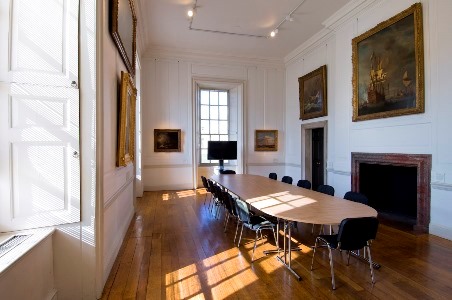 Elegant meeting room in The Queen's House with long table, ideal for events and presentations. - Banner