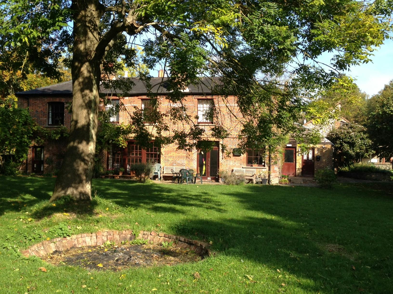 Great Hall at Inner Wealth Retreat, rustic brick venue for team-building and events.