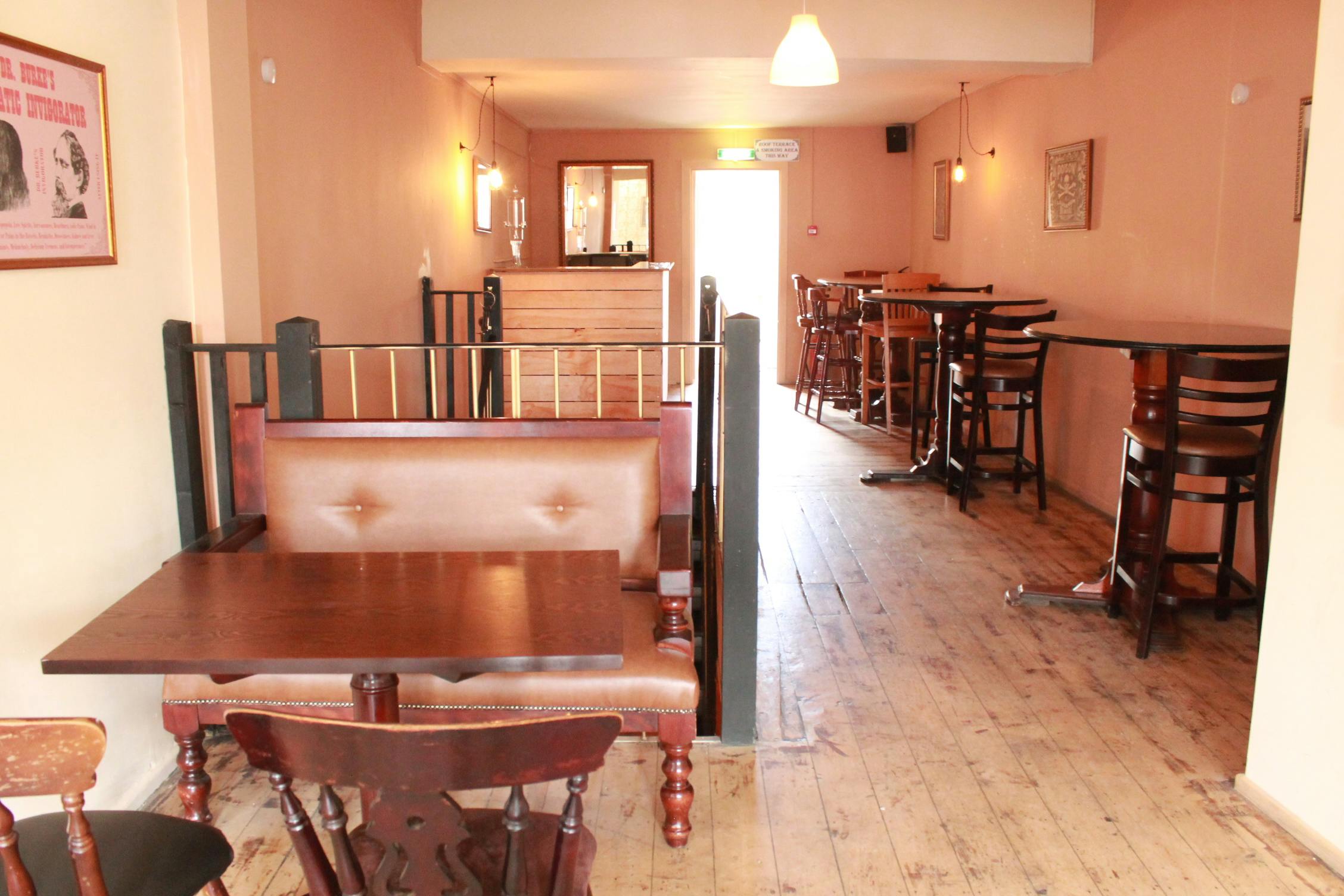 Versatile event space with wooden floors for networking events and workshops.